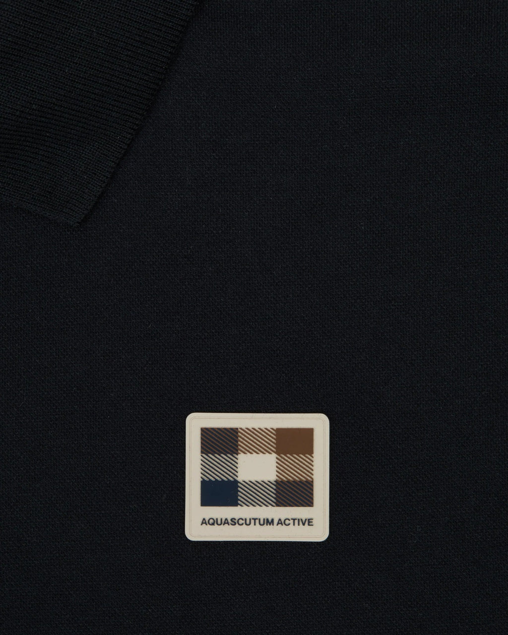 STRETCH PIQUE BADGE POLO
