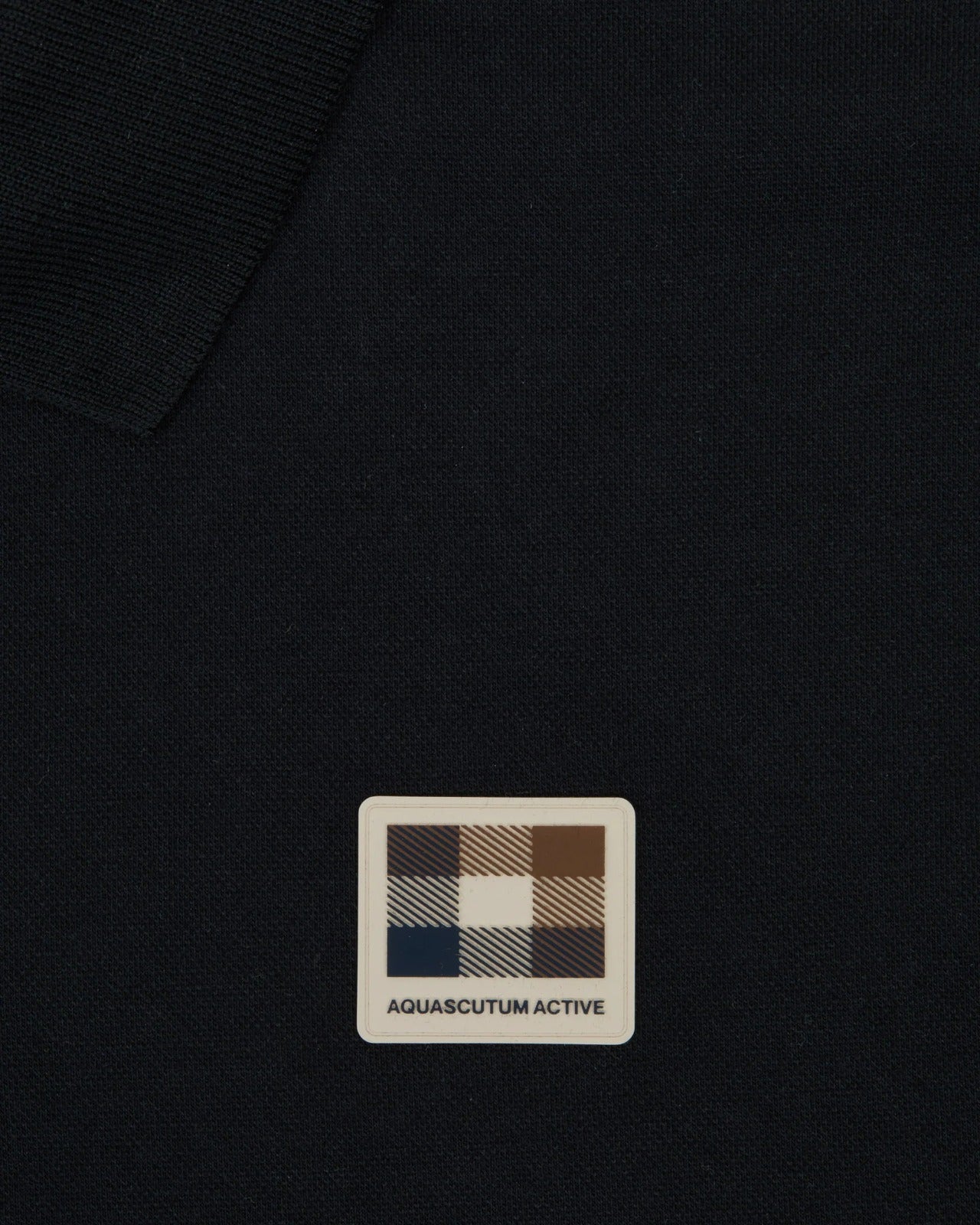 STRETCH PIQUE BADGE POLO