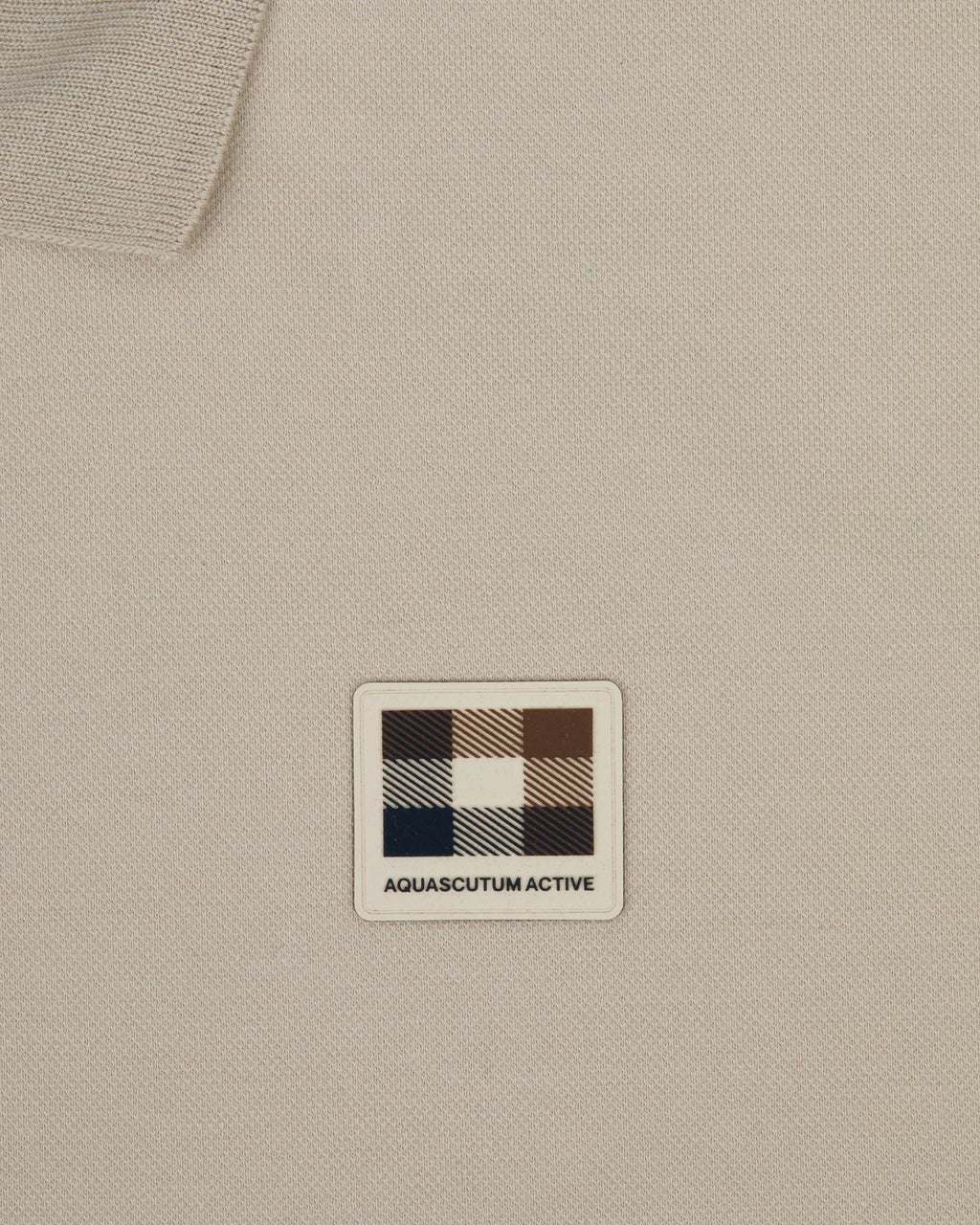 STRETCH PIQUE BADGE POLO
