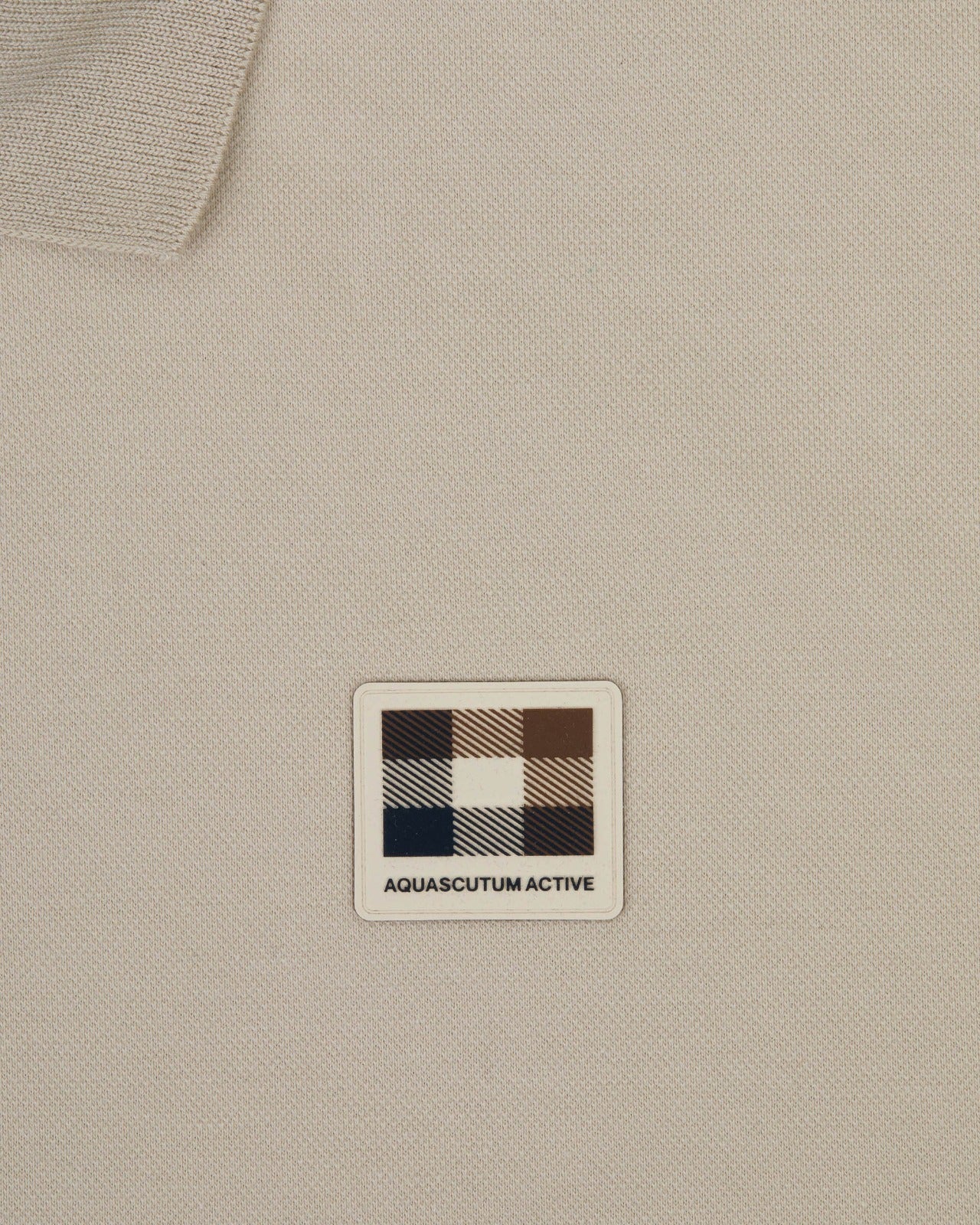 STRETCH PIQUE BADGE POLO